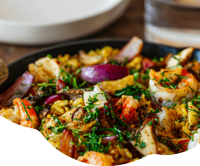 Arroz meloso con setas y langostinos